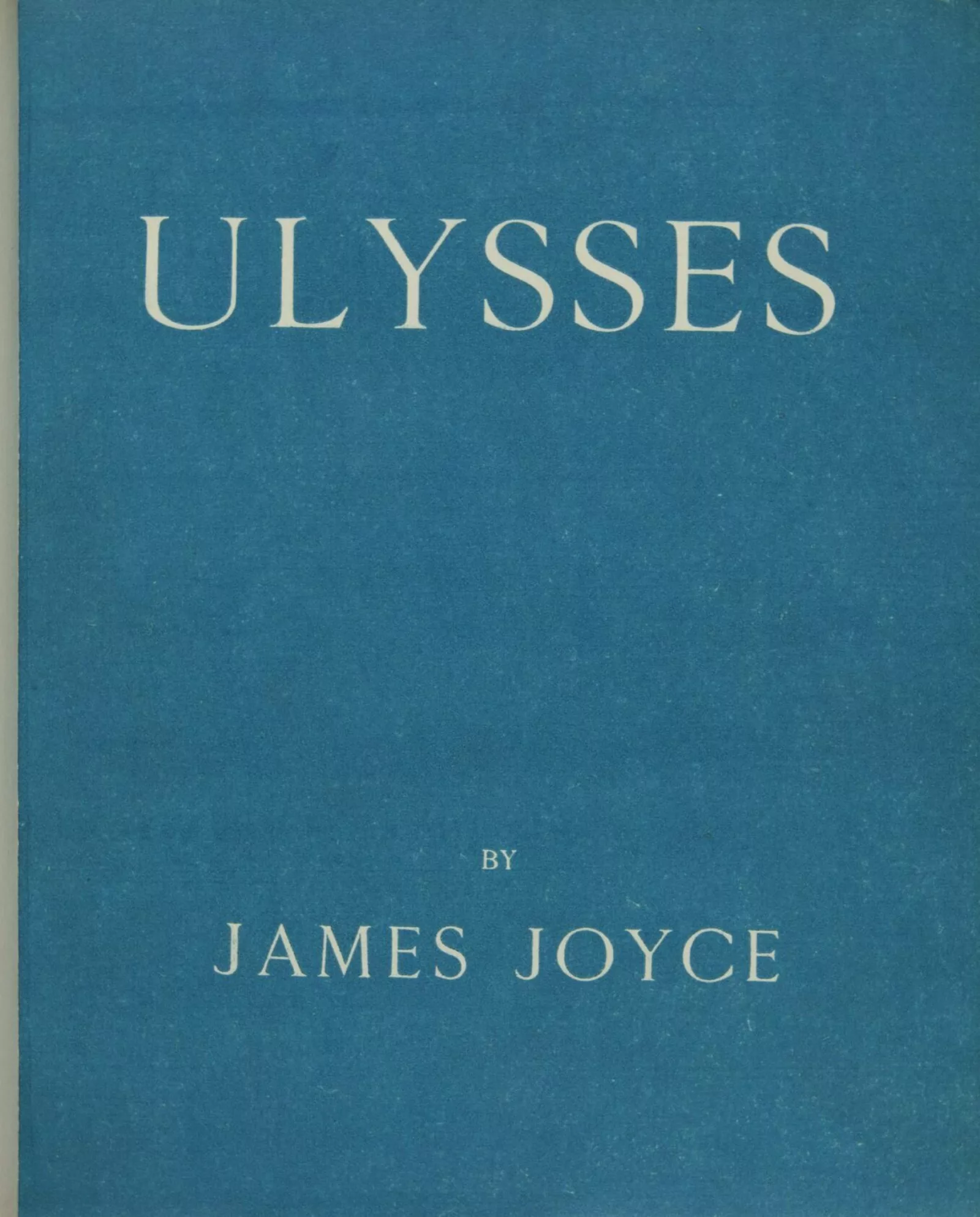 The first edition of Ulysses had a bare-bones cover design. The words "Ulysses by James Joyce" appear in white letters against a blue background.