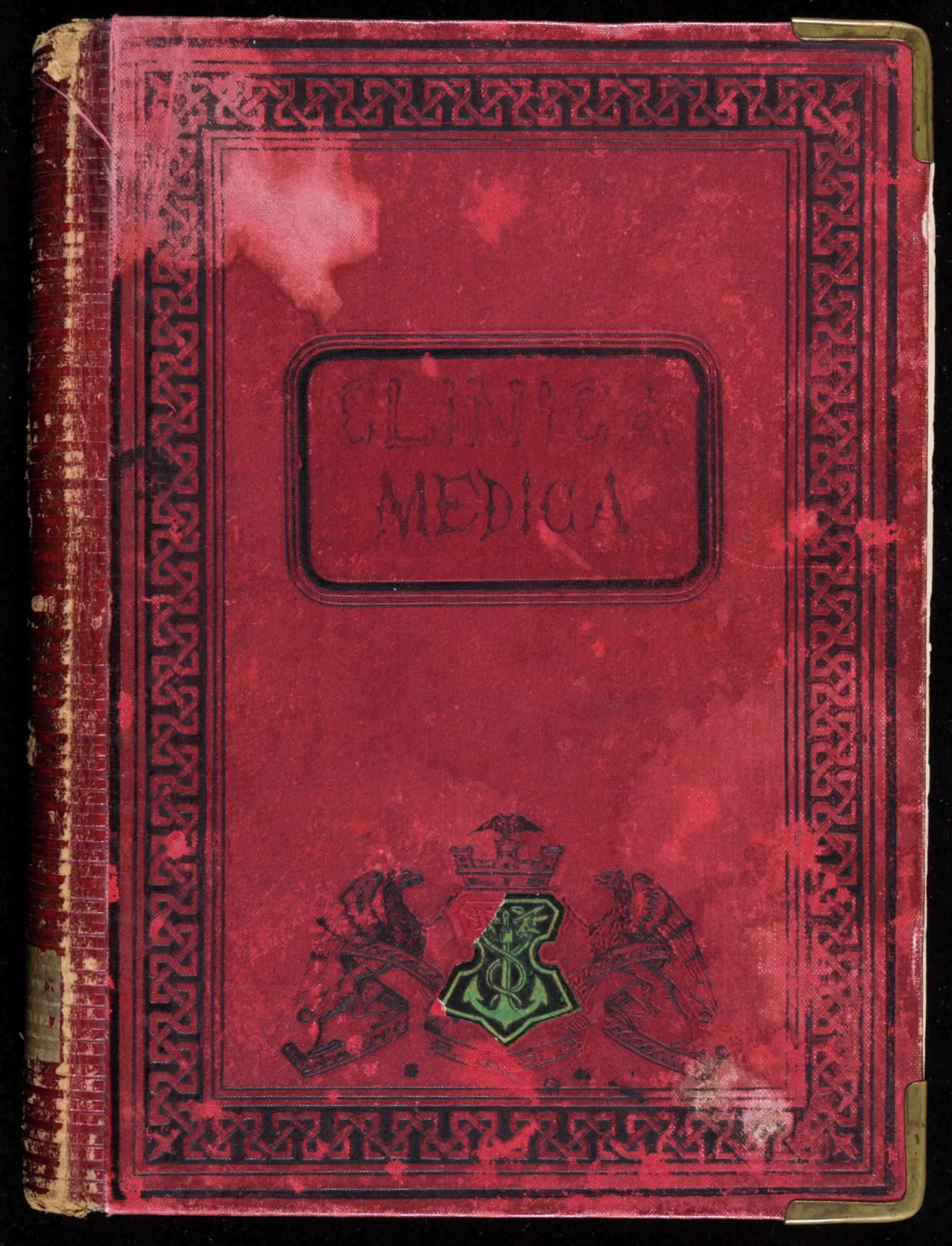 Front cover of Clínica Médica Front cover of Clínica Médica. The cover is red with black ornamental decorations along the border. The text "Clinica Medica" is printed in the center.