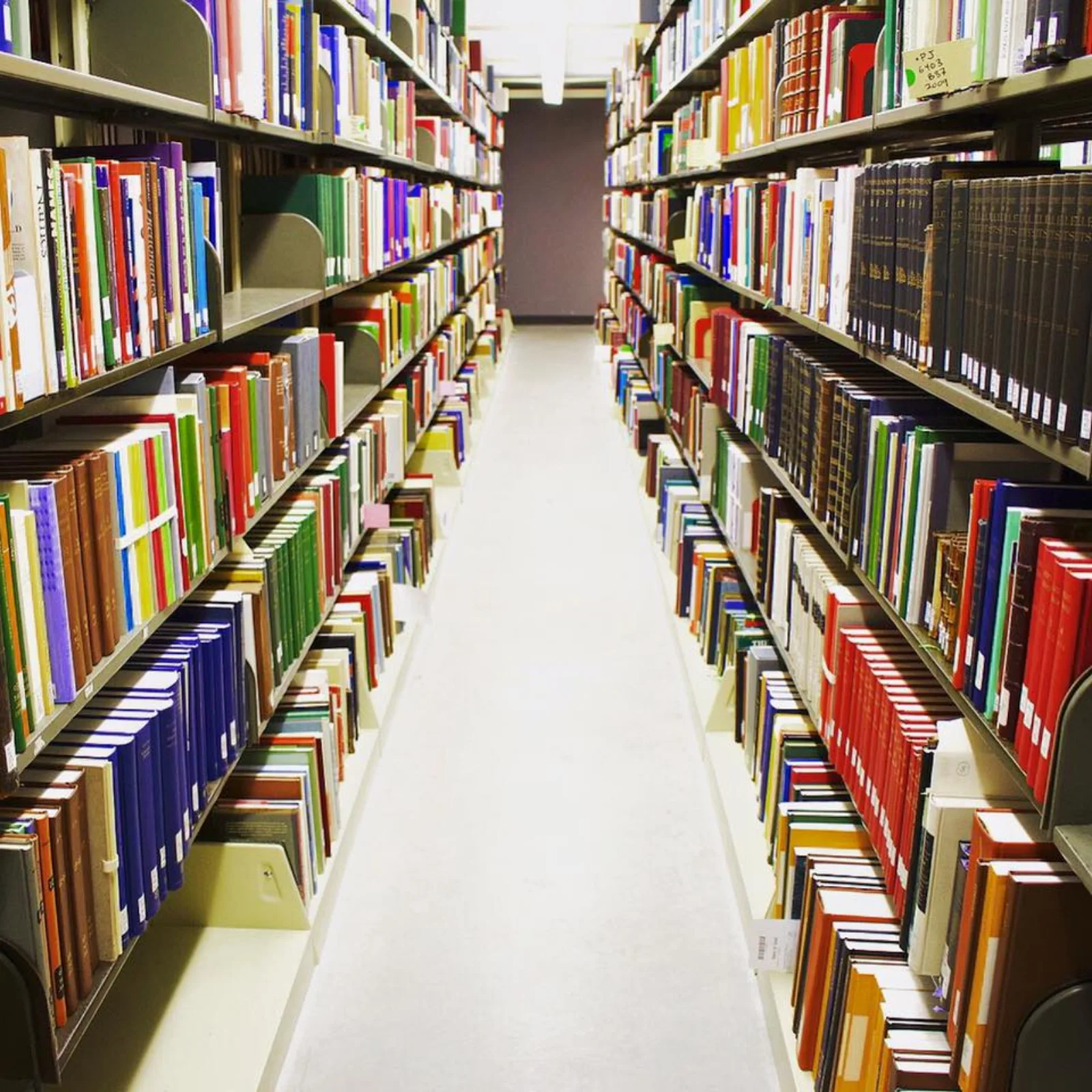 an aisle of collection materials in the Newberry's bookstack building.